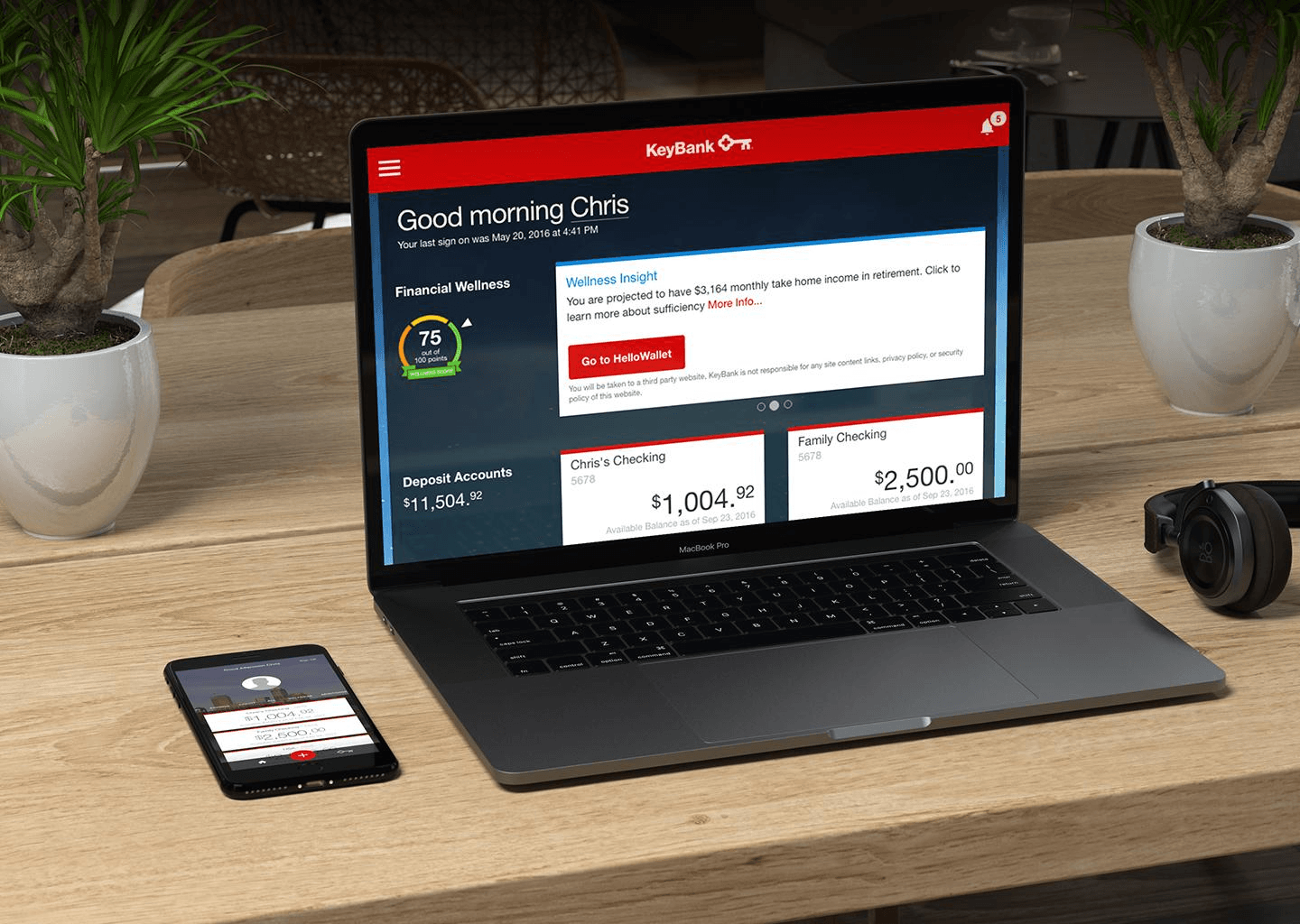 KeyBank online banking shown on a laptop and smartphone