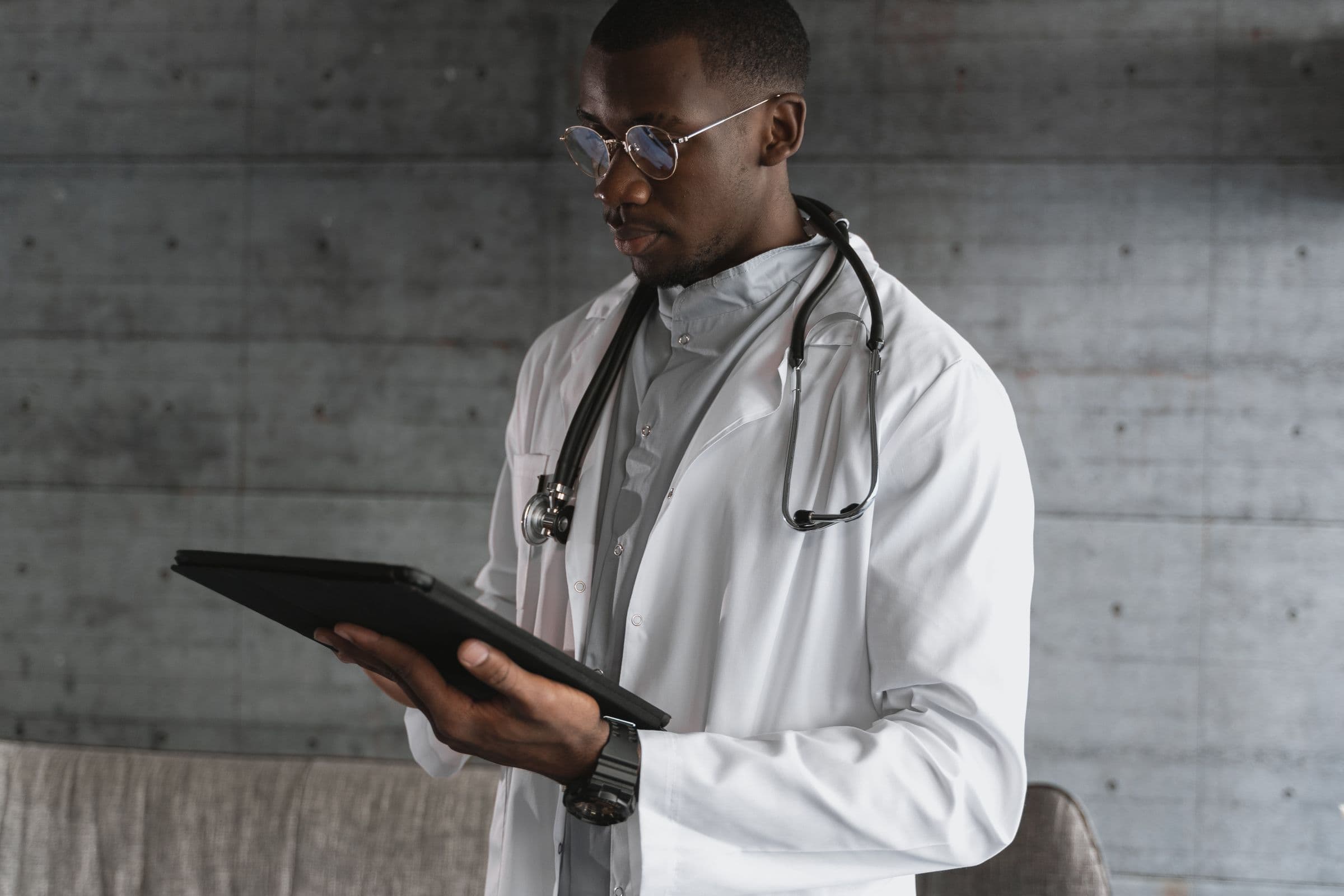 Physician reviewing a tablet