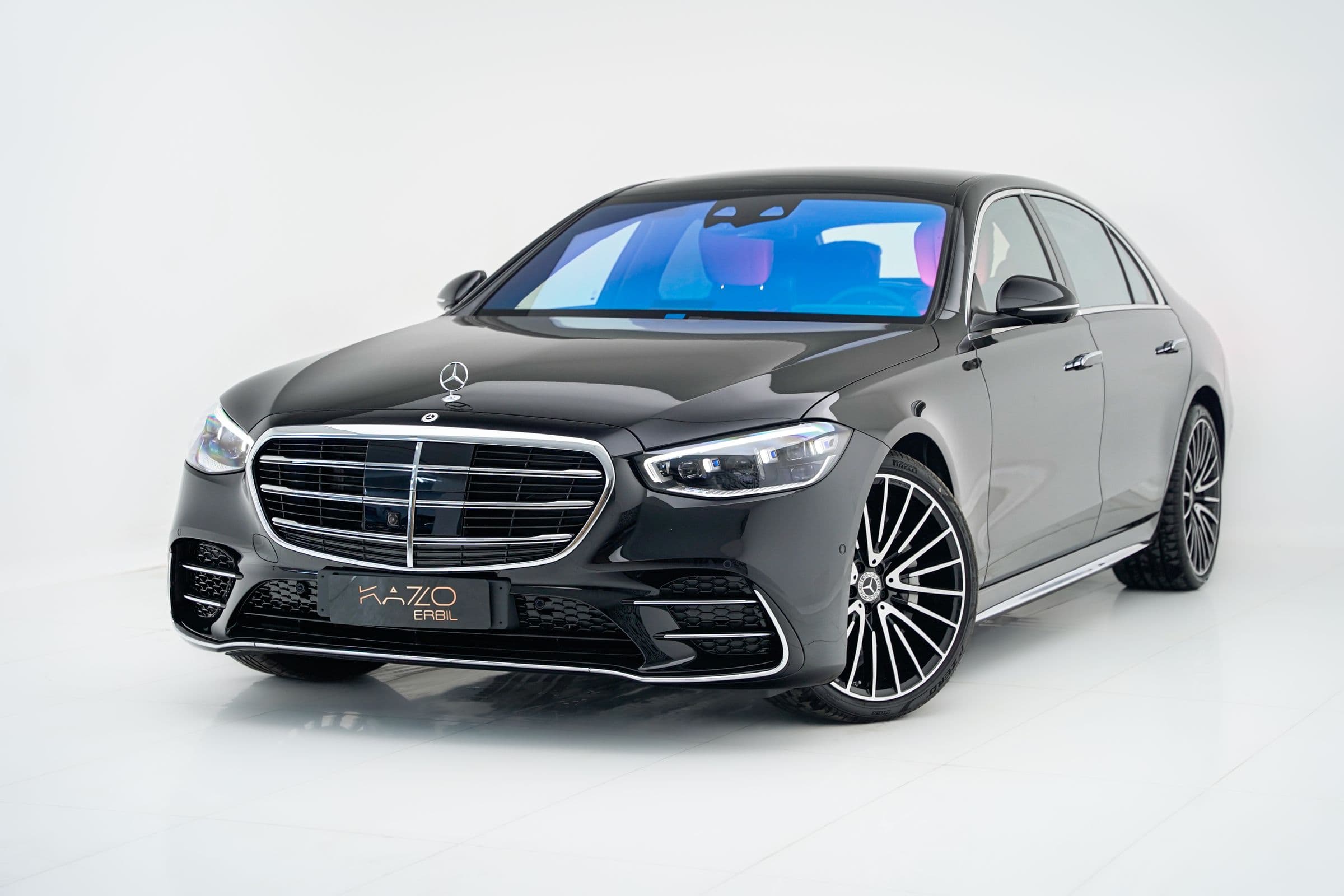 Dark sedan in a studio setting