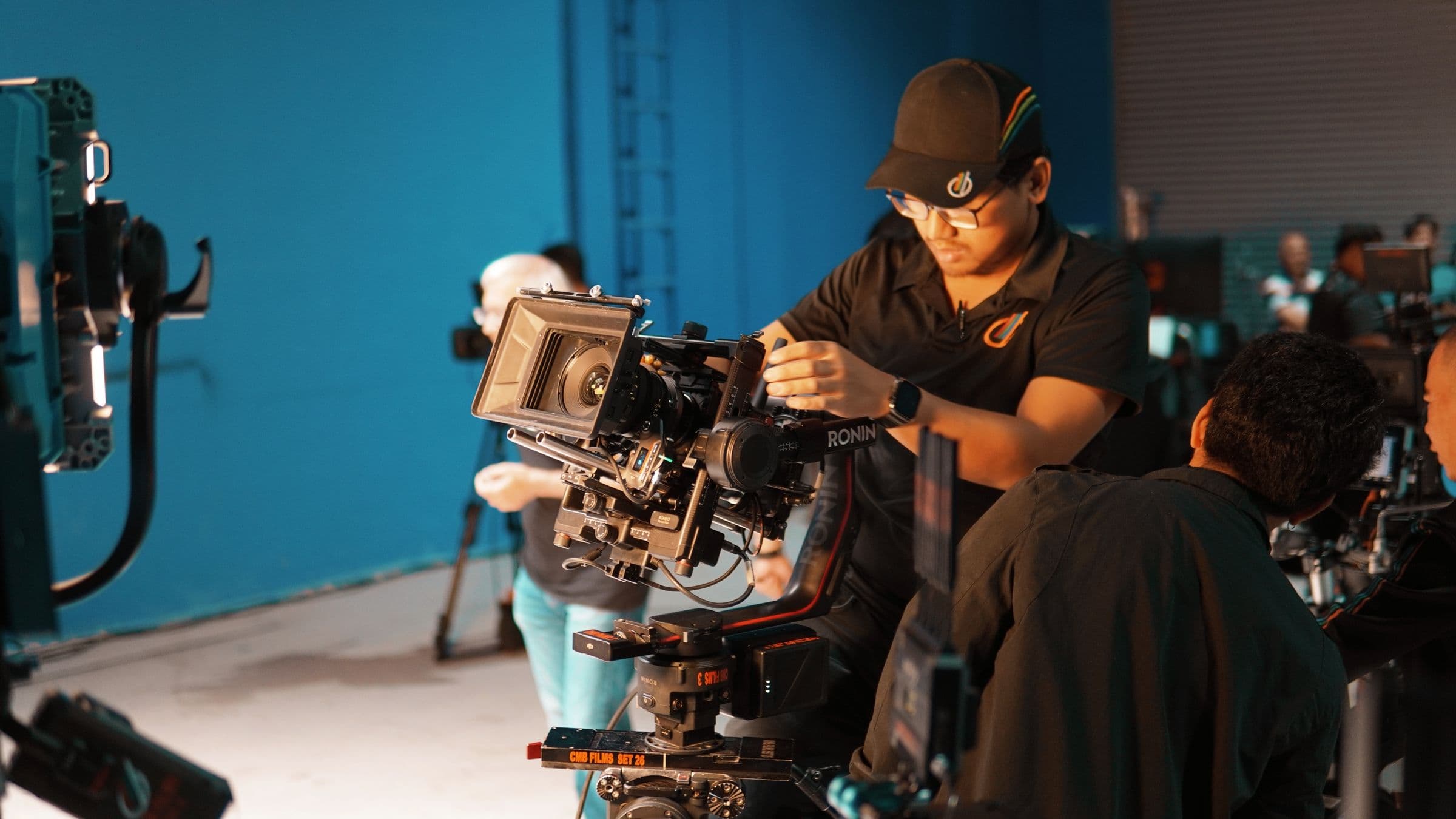 Camera operator filming on a production set