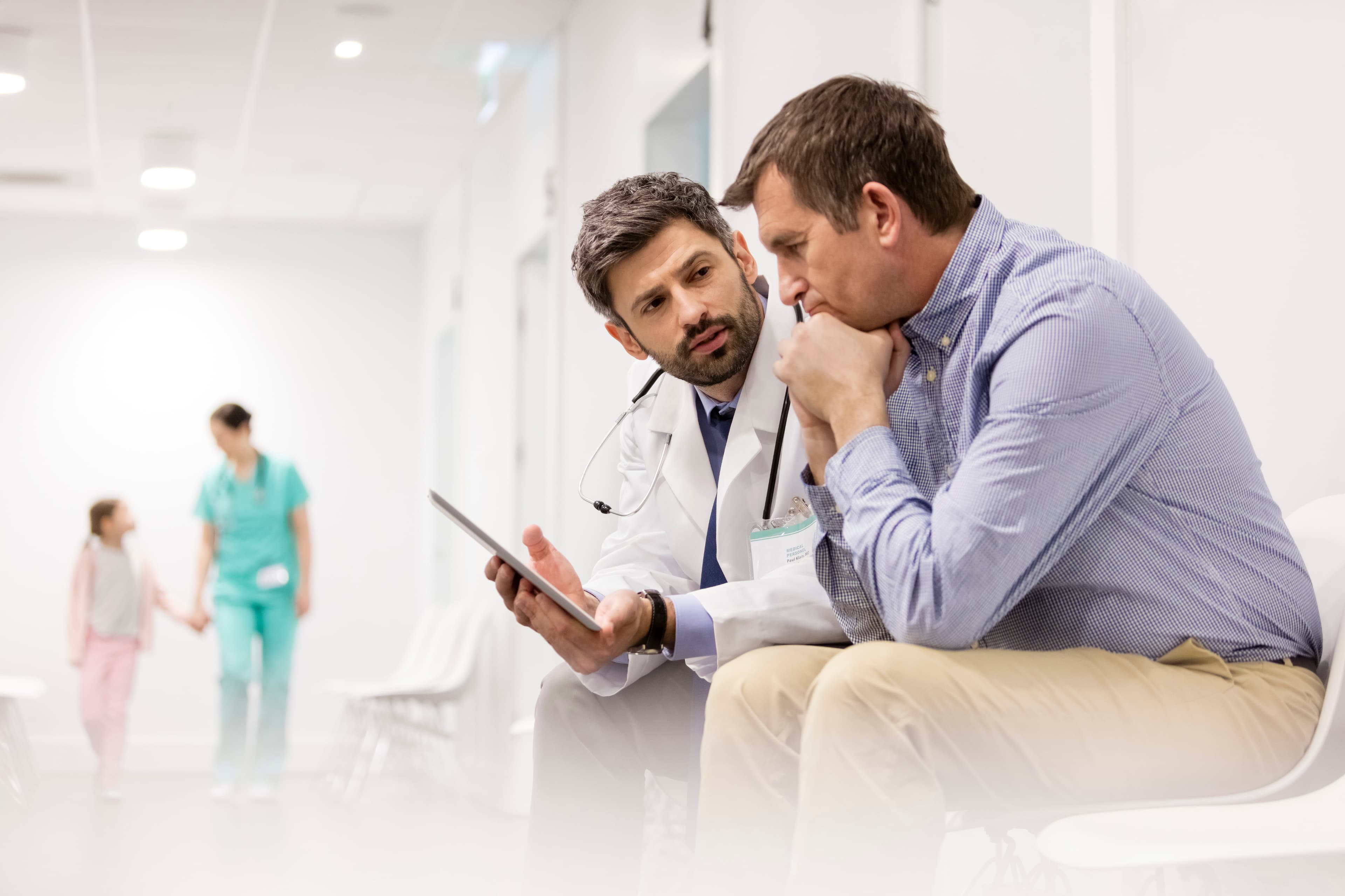 Clinician speaking with a patient