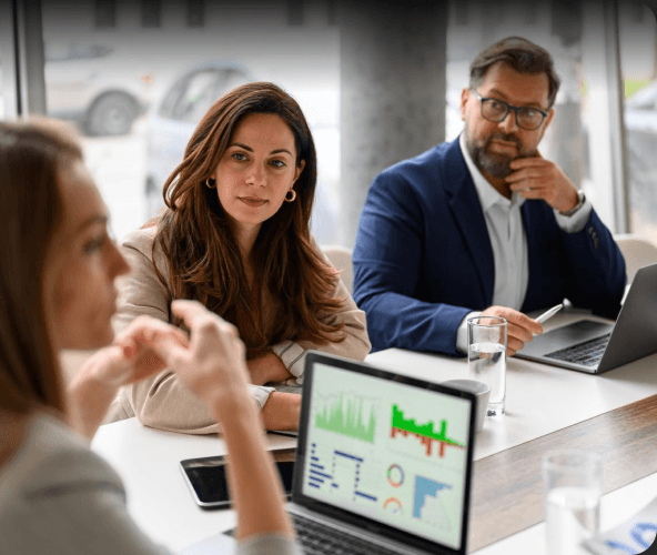 Leadership team reviewing growth performance in a meeting