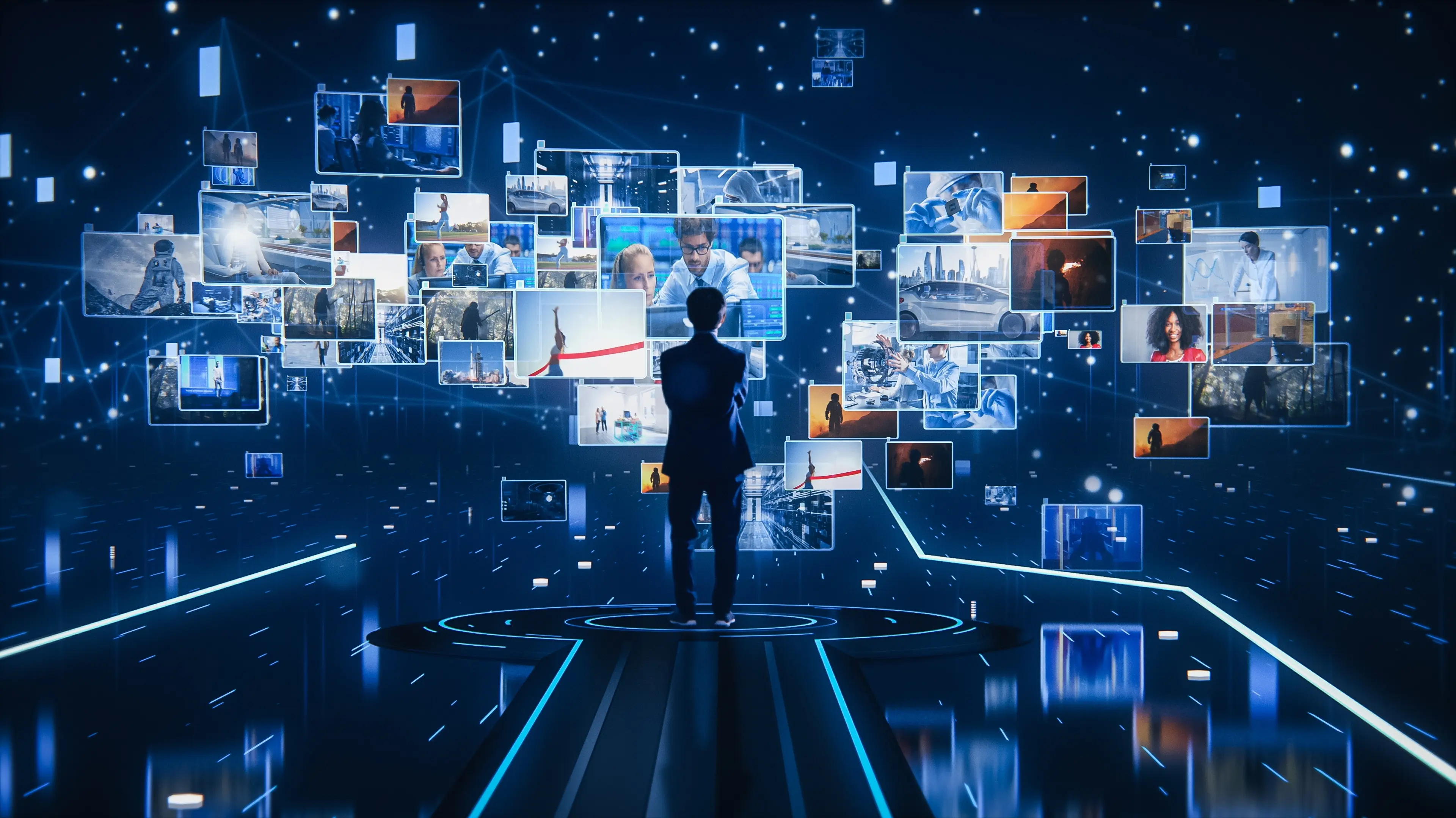 Person viewing a wall of digital media screens