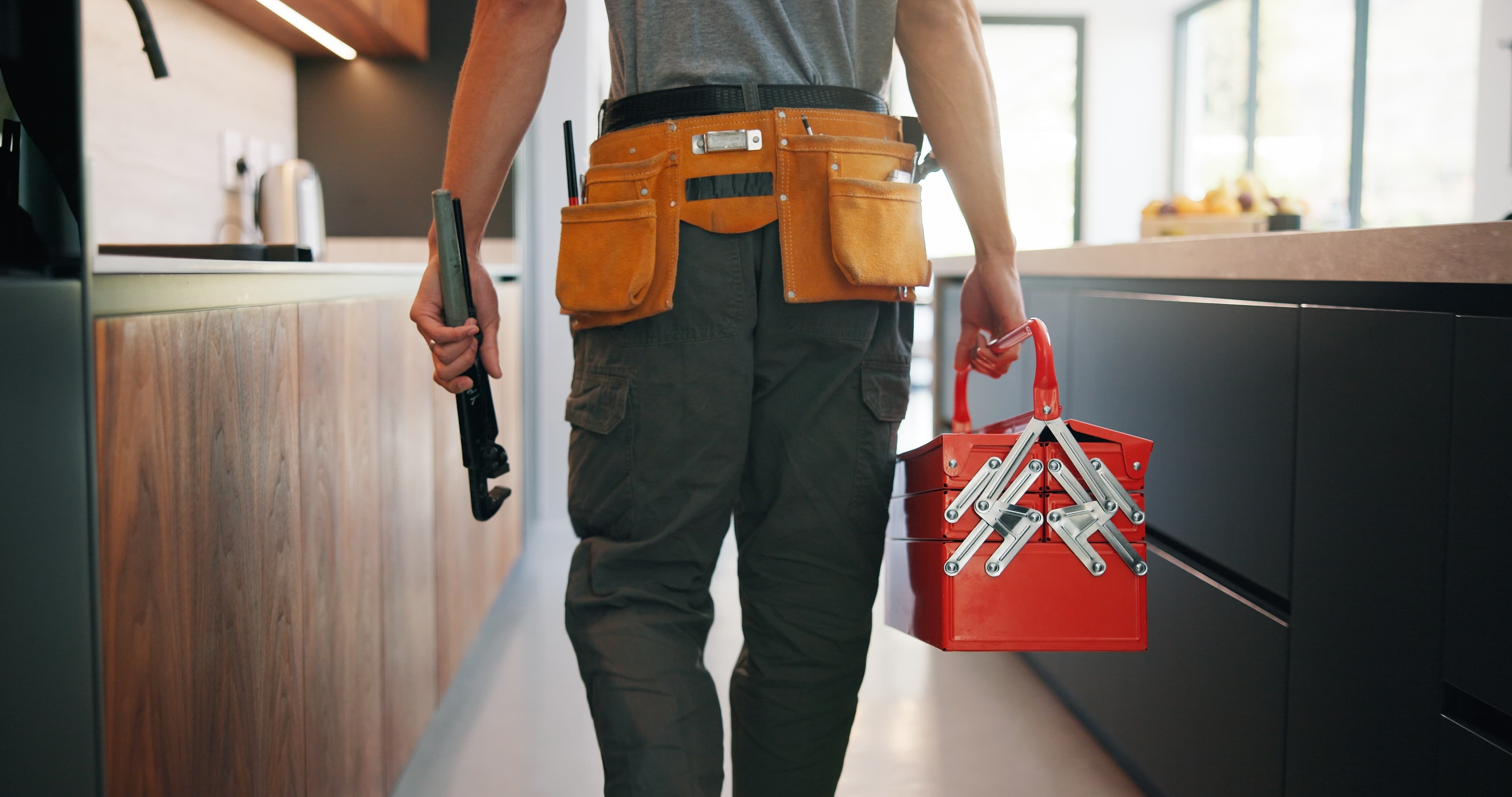 Home-services technician with a tool belt
