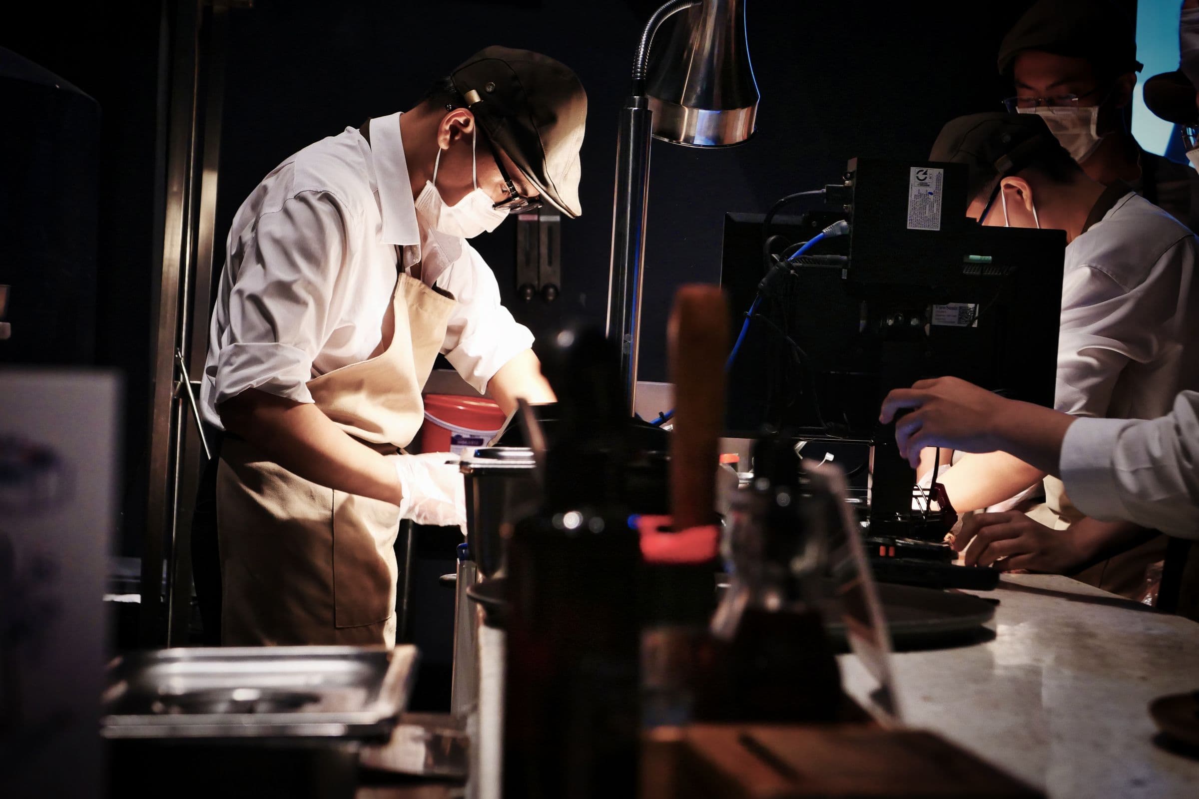 Chefs preparing food in a restaurant kitchen