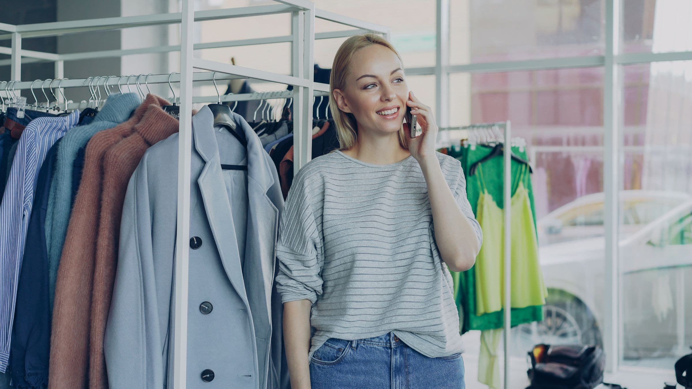 Shopper browsing clothing in a store